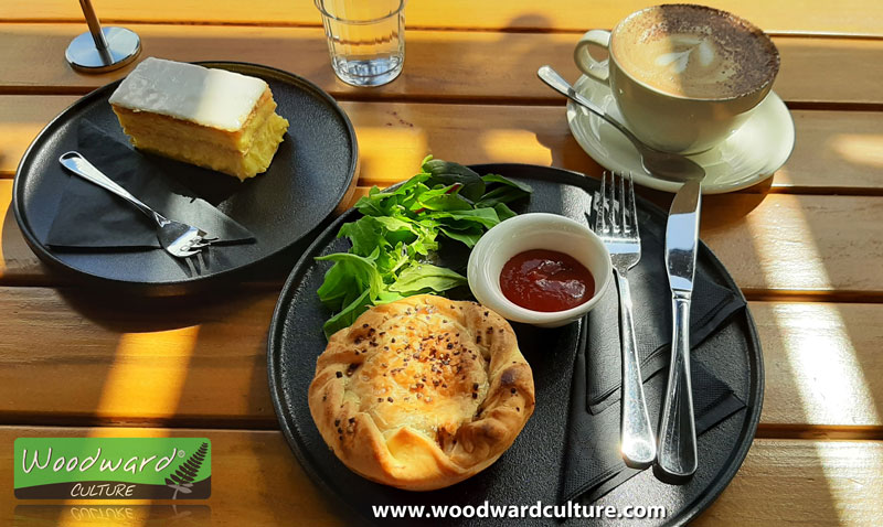 A fancy pie with a custard square and a cup of coffee at a café in New Zealand