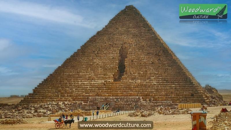 Pyramid of Menkaure in Giza, Egypt with its missing blocks on the north face. This is the smaller of the three main pyramids of Giza - Woodward Culture Travel Guide